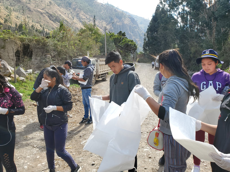 young adults preparing to clean river